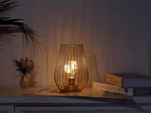 8-inch tall cage-shaped table lamp by JHY DESIGN, battery-operated metal wire cage with warm glow bulb