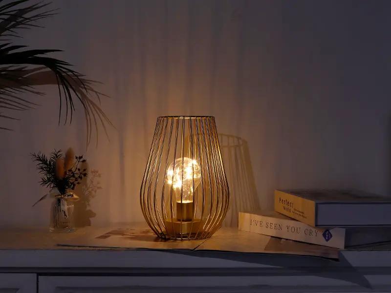 8-inch tall cage-shaped table lamp by JHY DESIGN, battery-operated metal wire cage with warm glow bulb