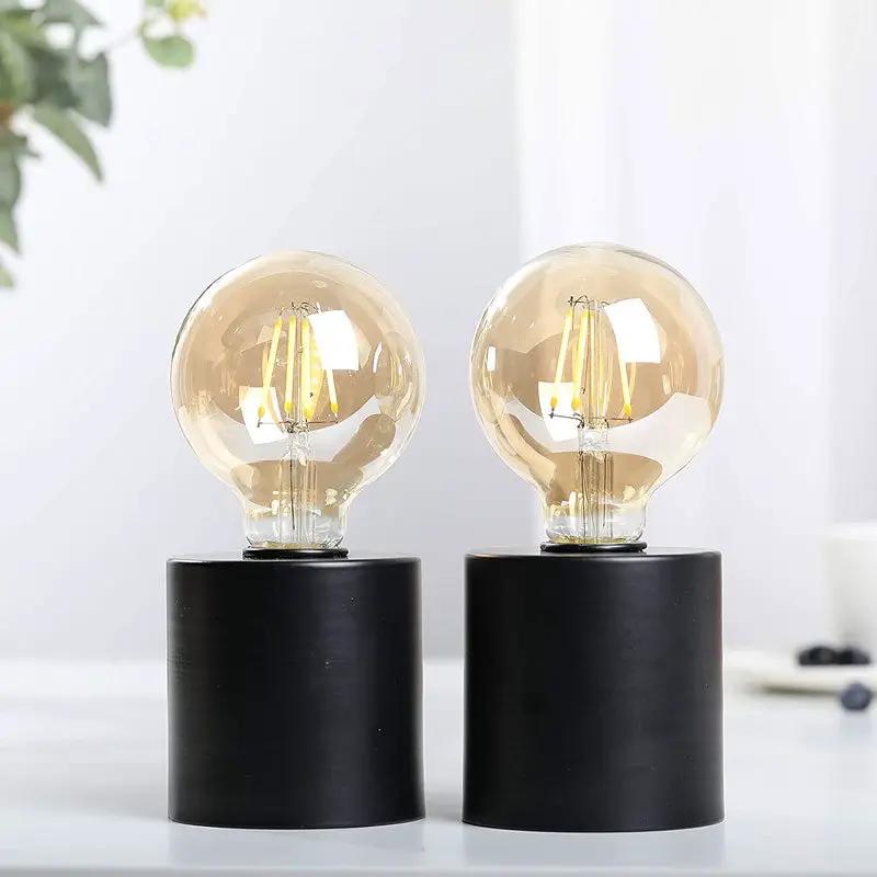 7-inch-tall black battery-powered table lamps set of 2 with clear glass bulbs by JHY DESIGN