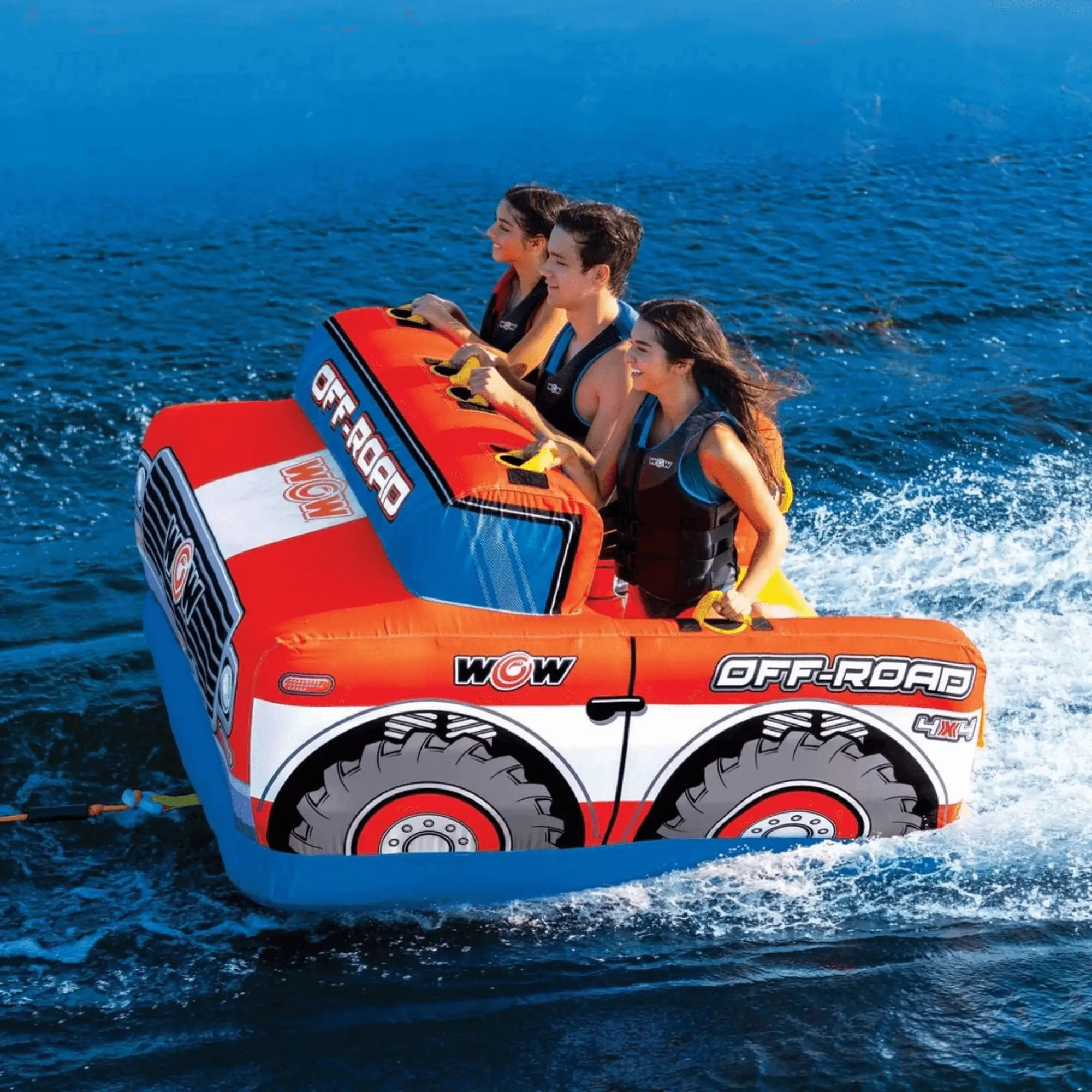 WOW Off-Road 3-Person Towable inflatable in orange with blue accents, three riders wearing life vests on the water.