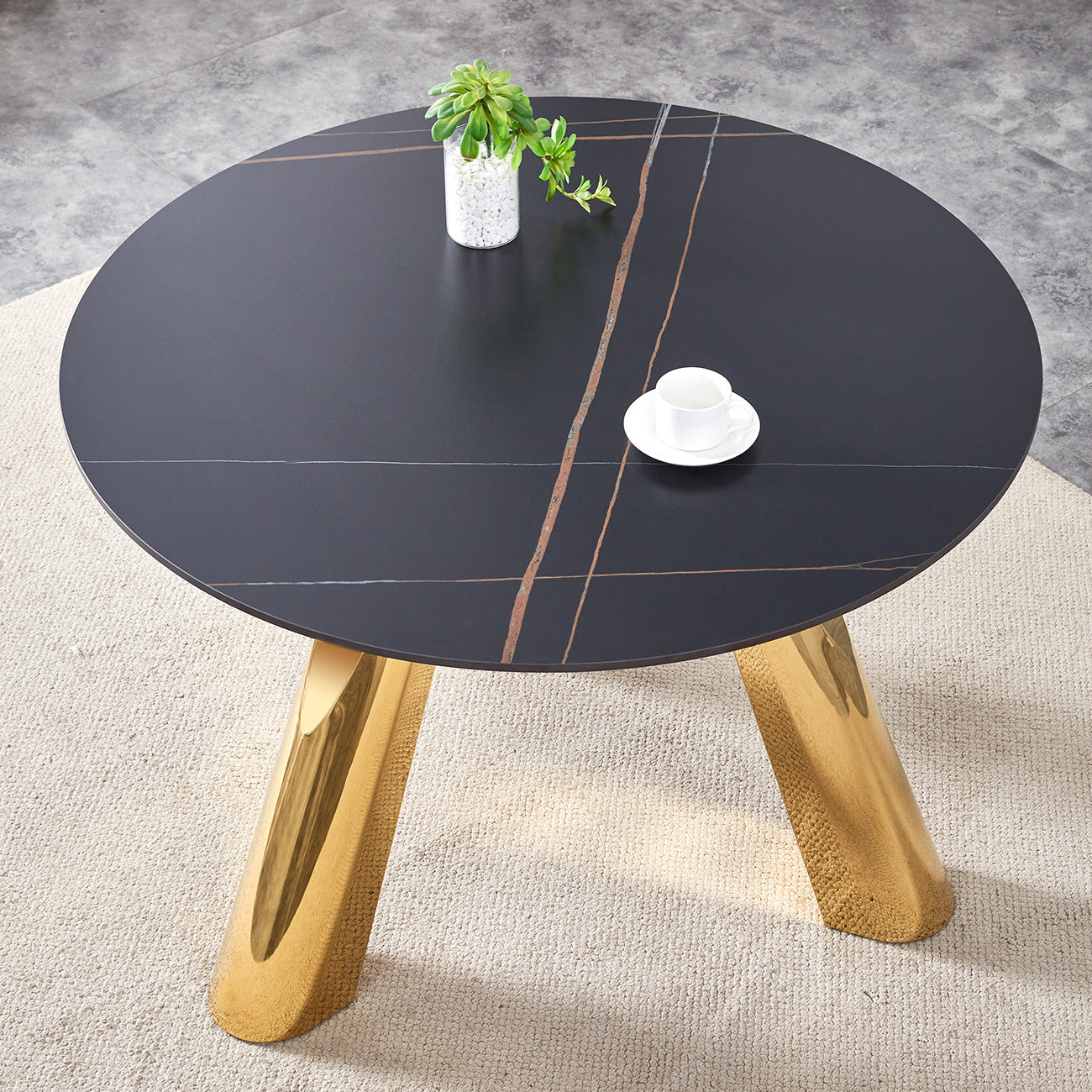 The 42-inch stainless steel gold-plated flamed granite round table with seating for 4 or 6 people is perfect for dining, entertaining, or as a conference table