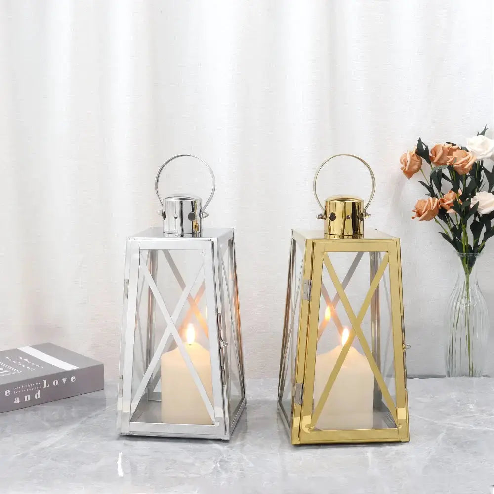 12''H stainless steel decorative lanterns, trapezoid with glass panels and crossbars; two in silver and gold finishes
