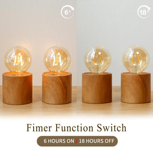 Set of 4 wood grain battery-operated table lamps with clear glass bulbs on wooden bases