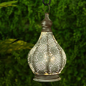 11.5'' Tall Battery Powered Table Lamp; antique-gray metal lantern with intricate perforated pattern.