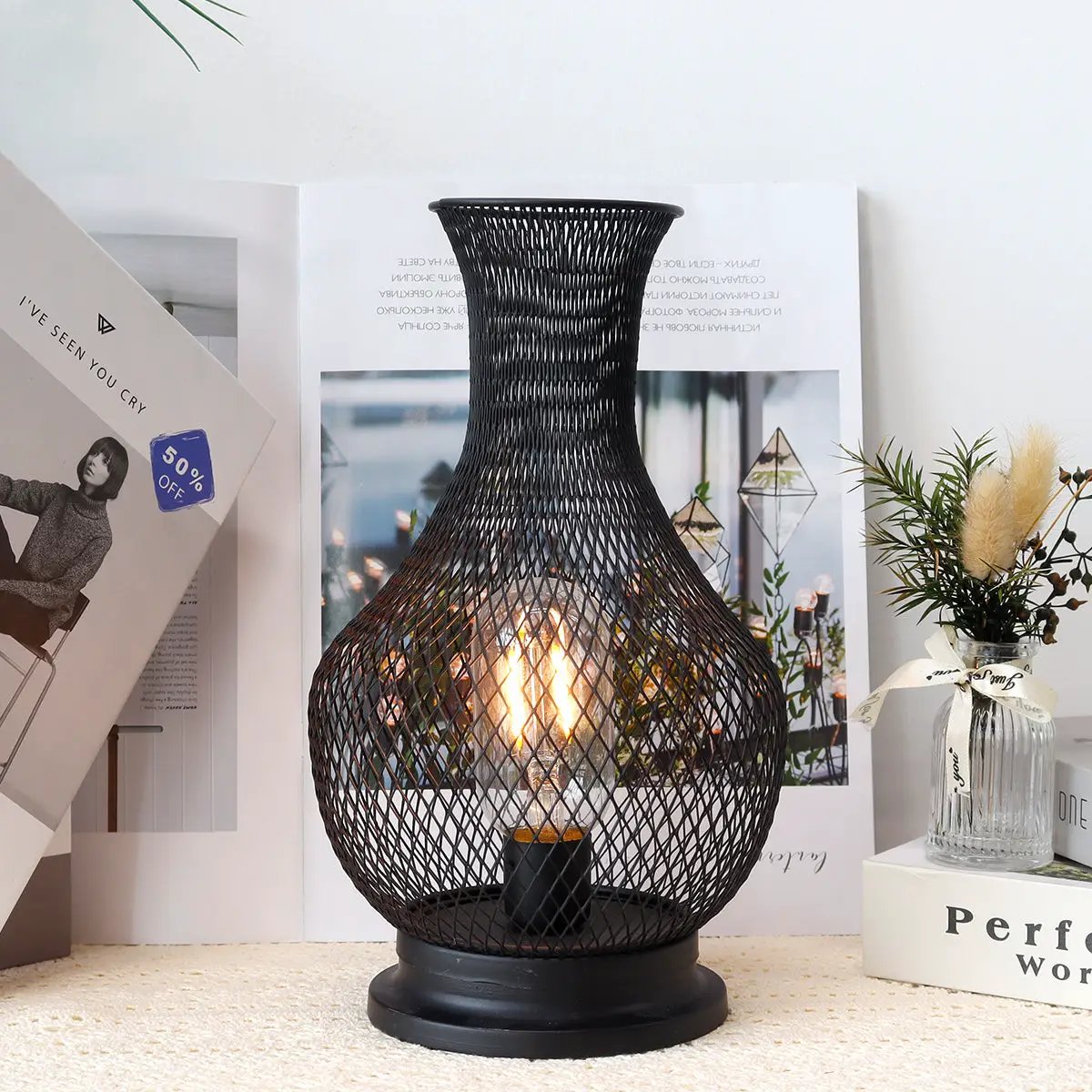 11-inch tall battery-operated lamp with LED Edison bulb in a black metal mesh lantern