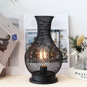 11-inch tall battery-operated lamp with LED Edison bulb in a black metal mesh lantern