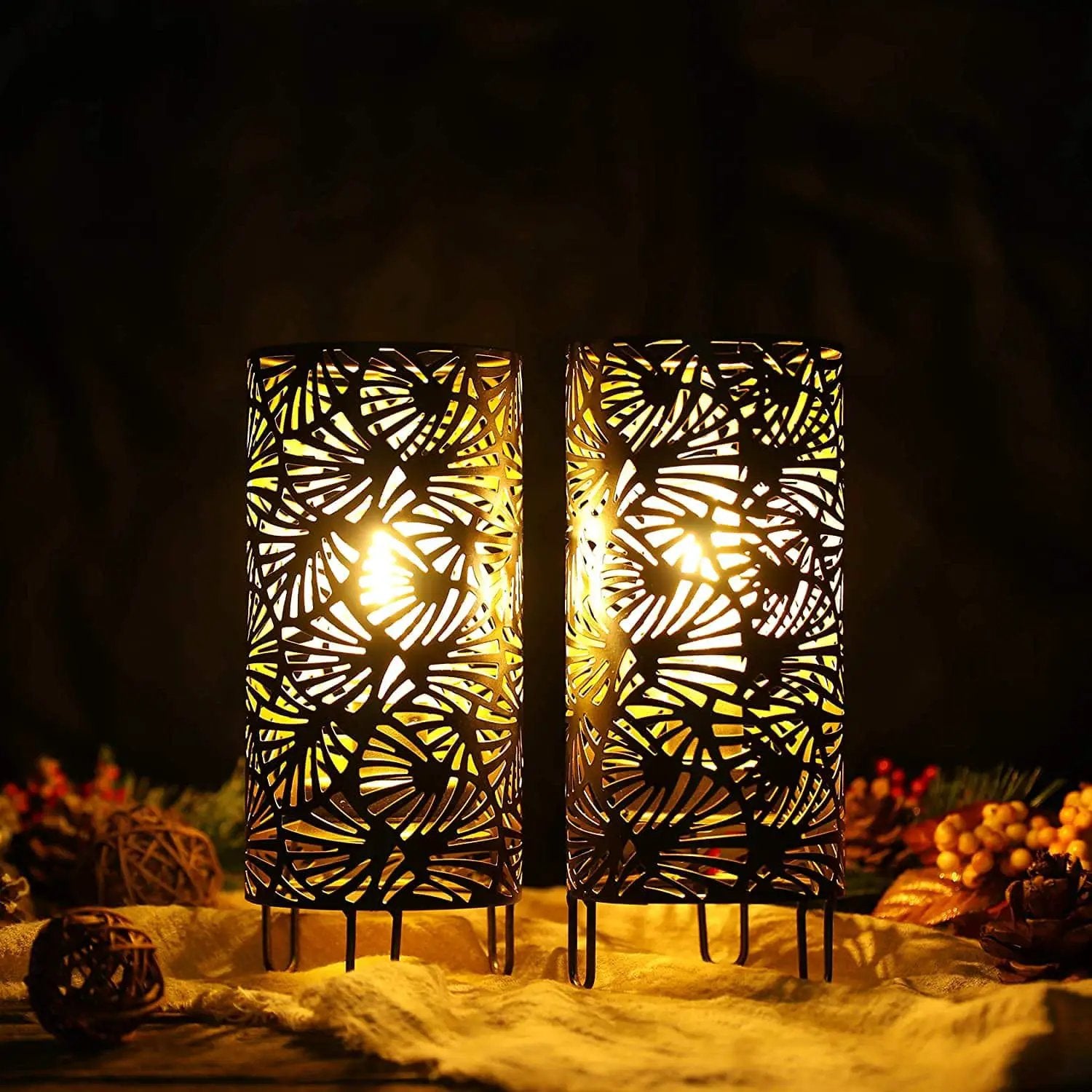 Set of 2 9-inch high metal lamps with intricate cut-out patterns, battery powered.