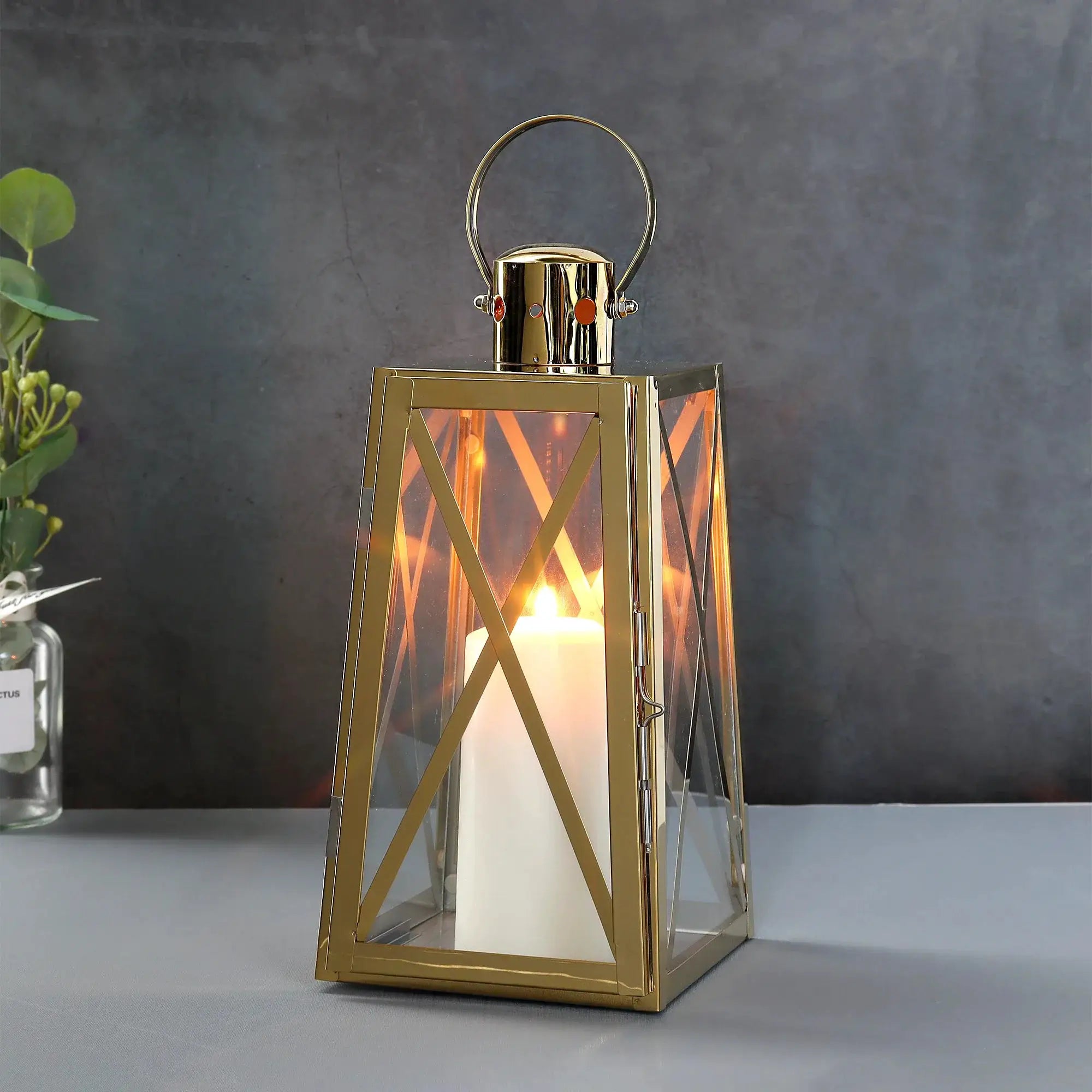 12''H Stainless Steel Decorative Lantern (Trapezoid) by JHY DESIGN with gold finish and glass panels.