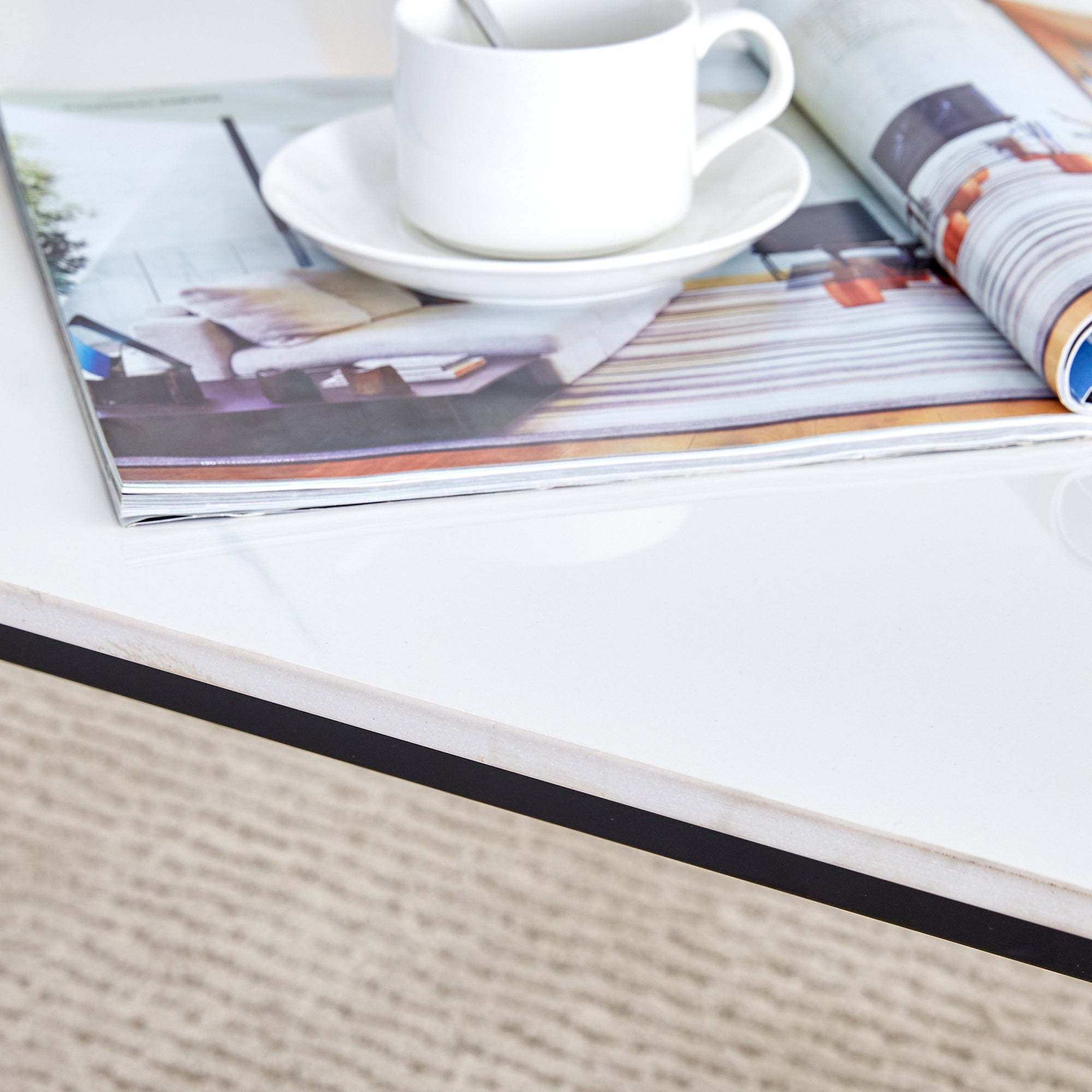 A coffee table made of rock slab material, with a smooth and natural surface that complements the modern design of the black metal legs, making it suitable for living rooms of all sizes.47*23.6