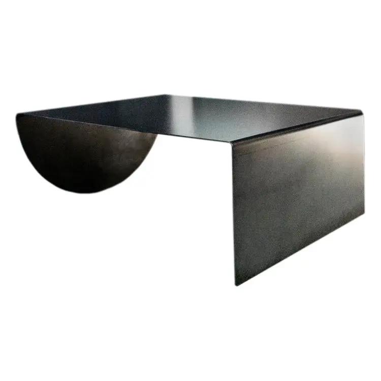 Asymmetrical heavy-duty raw-steel coffee table with curved arc support and flat top