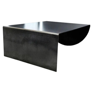 Asymmetrical metal coffee table by Villohome in raw steel with curved side extension
