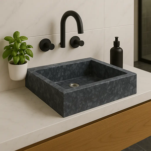 Gray marble vessel sink with a matte black faucet on a white countertop.