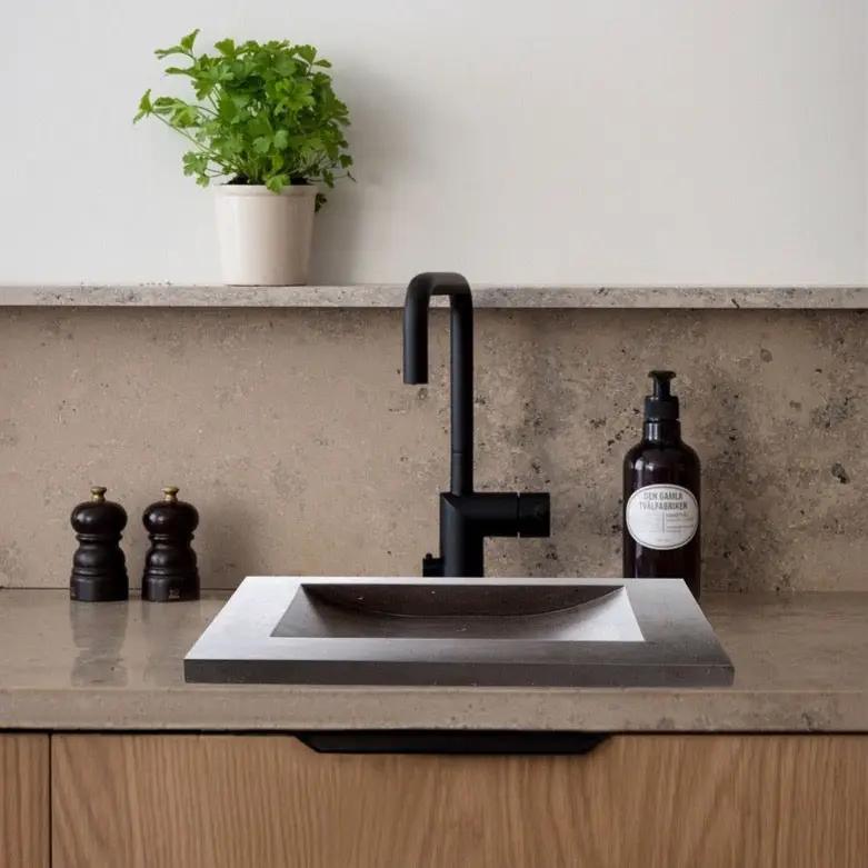 Black Andesite rectangular bathroom sink with honed matte finish.