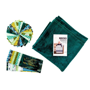 Quilt kit Bricks and Beams Dinosaurs by Block Party Quilt Co; teal fabric bundle with a colorful square fabric stack