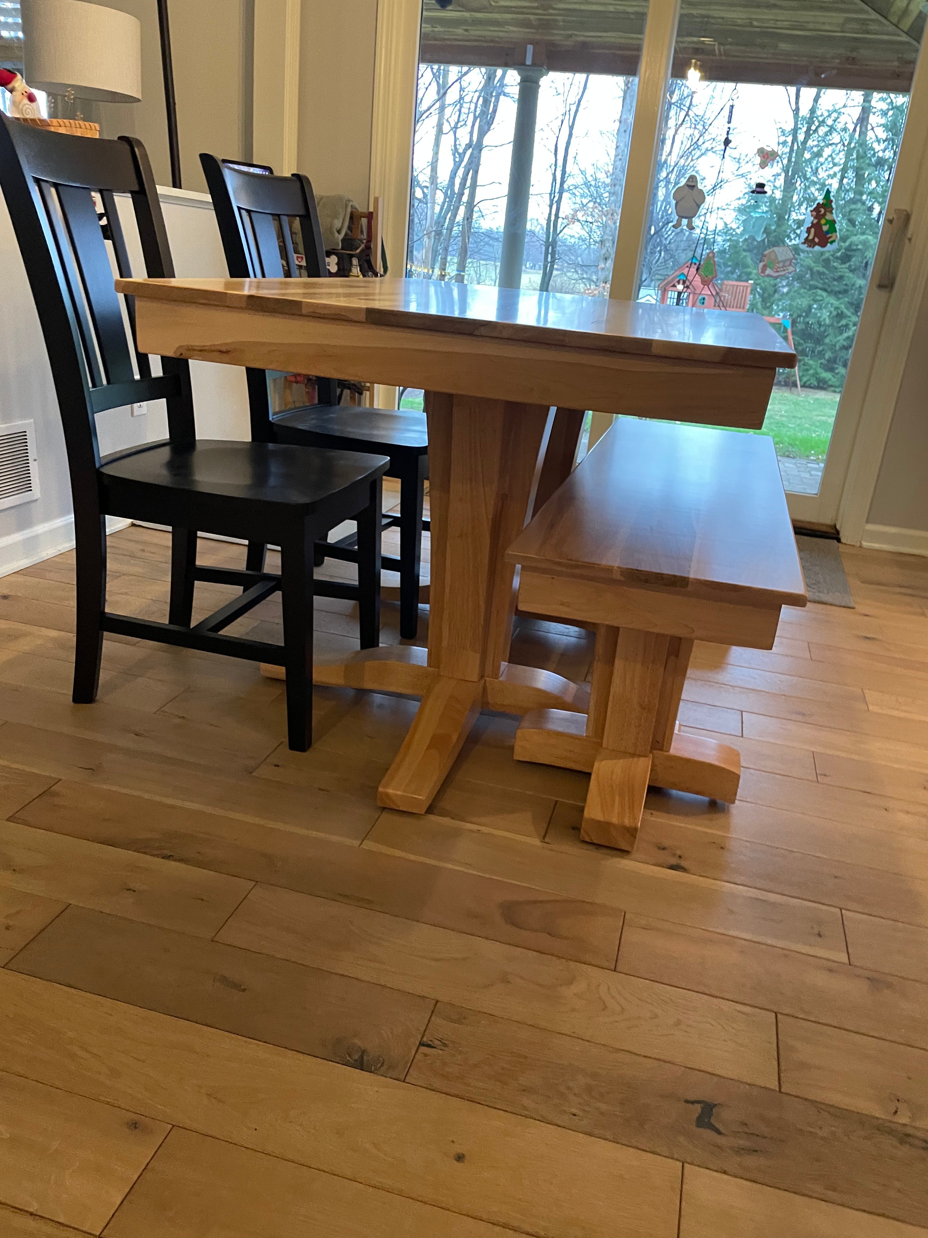 Terresa Style Leg Bench in natural wood with matching table and black chairs