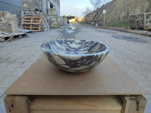 Calacatta Viola marble oval vanity sink, white with purple veining, 18in wide by 14in long.