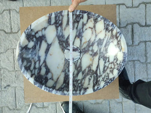Calacatta Viola marble oval bathroom sink, white with purple veining and a centered drain