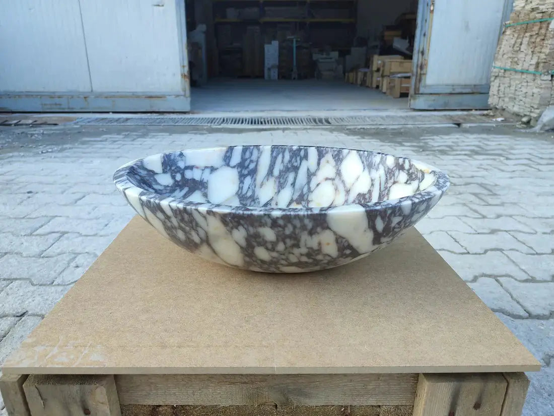 Calacatta Viola marble oval bathroom sink by Villohome; white with dark gray veining.
