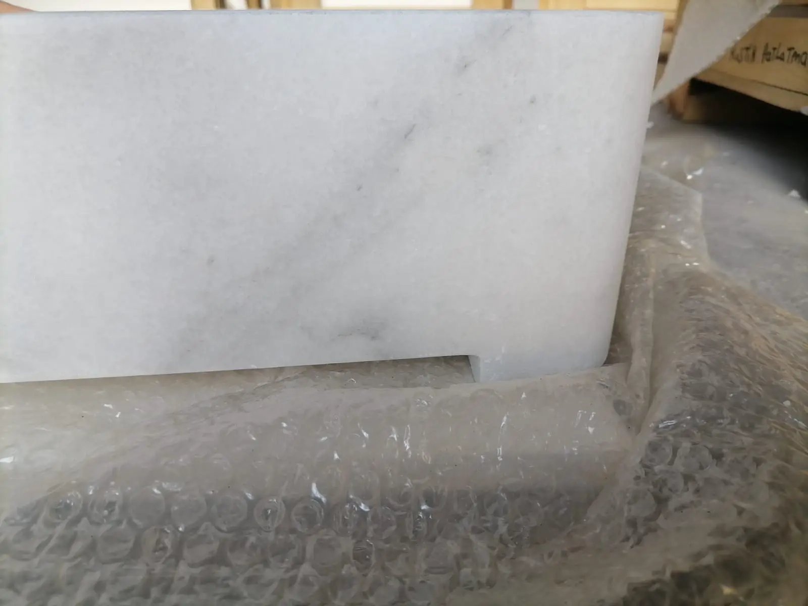 Carrara white marble wall-mount bathroom sink with ribbed texture