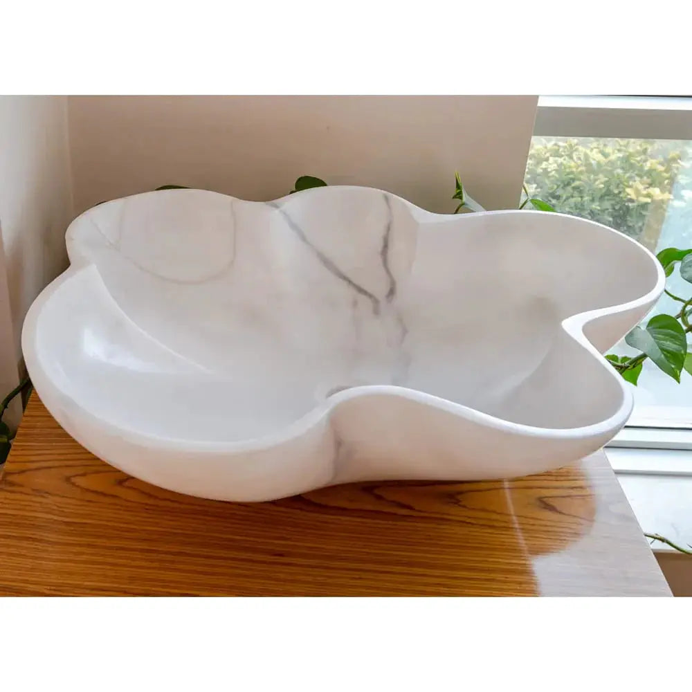 Bathroom sink: Villohome Carrara white marble above-vanity basin, polished, flower-shaped.