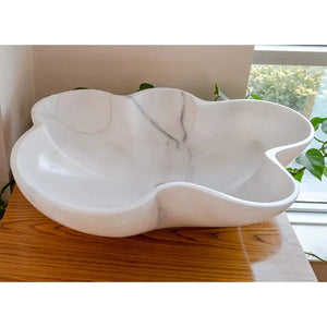 Bathroom sink: Villohome Carrara white marble above-vanity basin, polished, flower-shaped.
