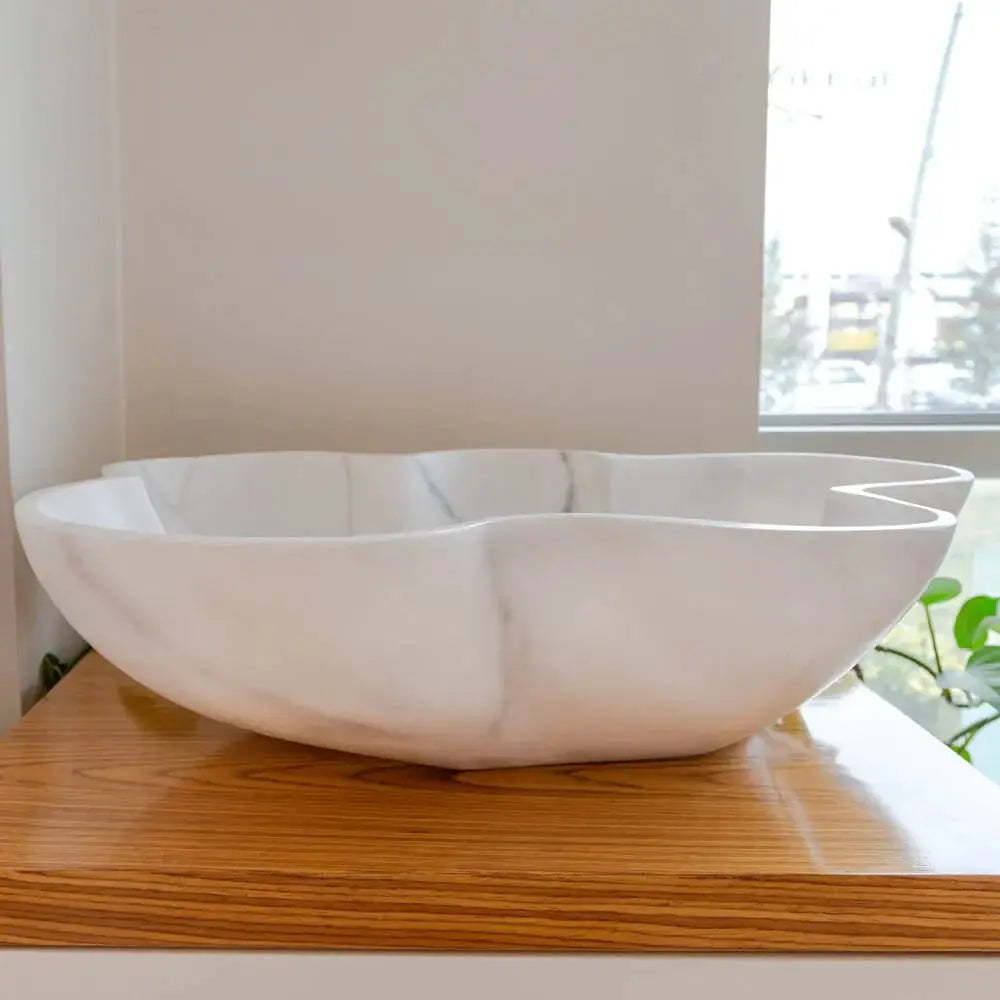 Bathroom vessel sink in Carrara white marble by Villohome, polished, on wood vanity