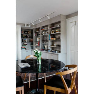 Round black marble dining table with polished, eased edge by Villohome