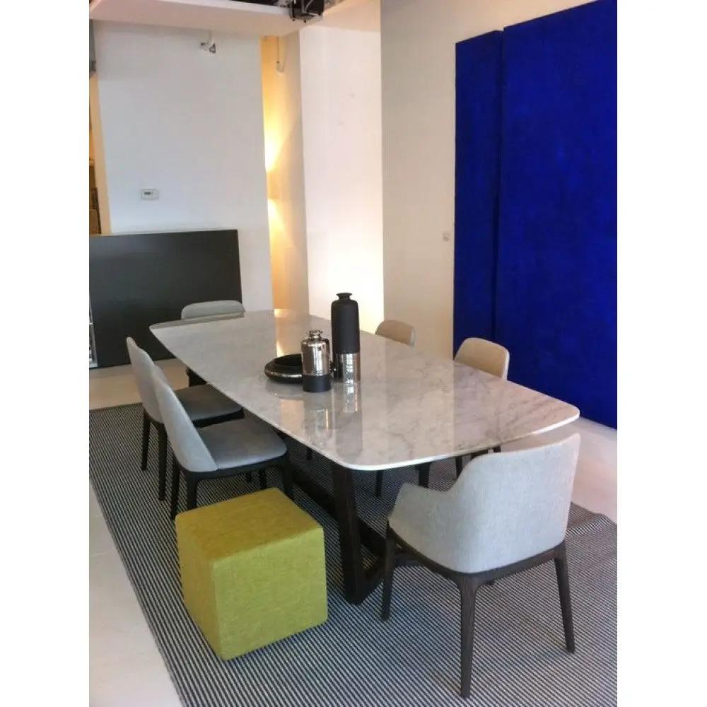 Marble dining table, rectangular with eased edge, polished white marble with gray veining; seats six.