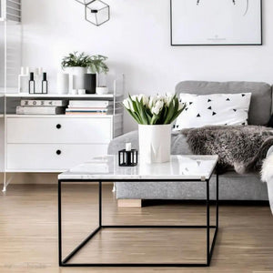 Marble square coffee table by Villohome with polished and eased edge and a black metal frame.
