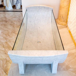 Carrara White Marble Bathtub with tempered glass side walls and polished finish by Villohome