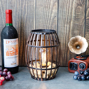 8-inch cordless metal wine-barrel lamp in black brushed-gold finish with an exposed Edison bulb.