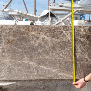 Emperador Light marble bathtub hand-carved from solid marble; 29.5W x 67L x 19.5H, on site with tape measure