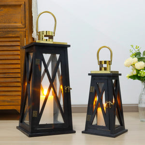 Set of two black farmhouse wooden lanterns with gold tops, glass panels, 12-inch and 18-inch heights