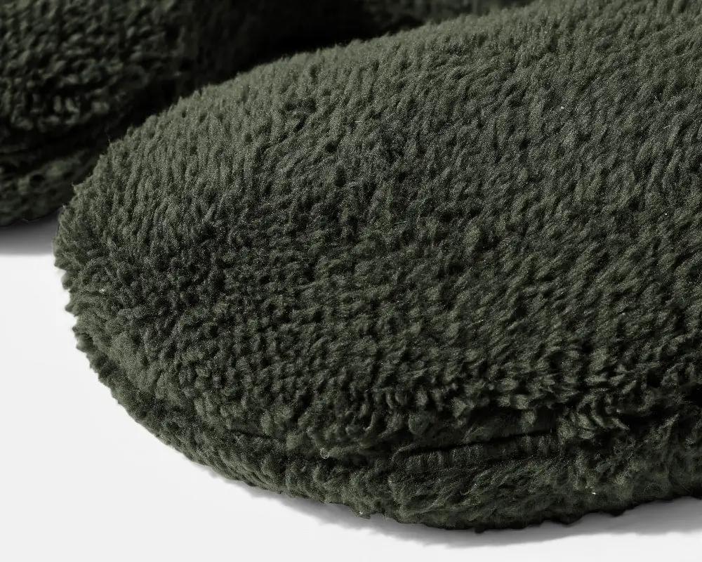 Weighted Neck Pillow by Gravity Blankets, dark green plush travel pillow.