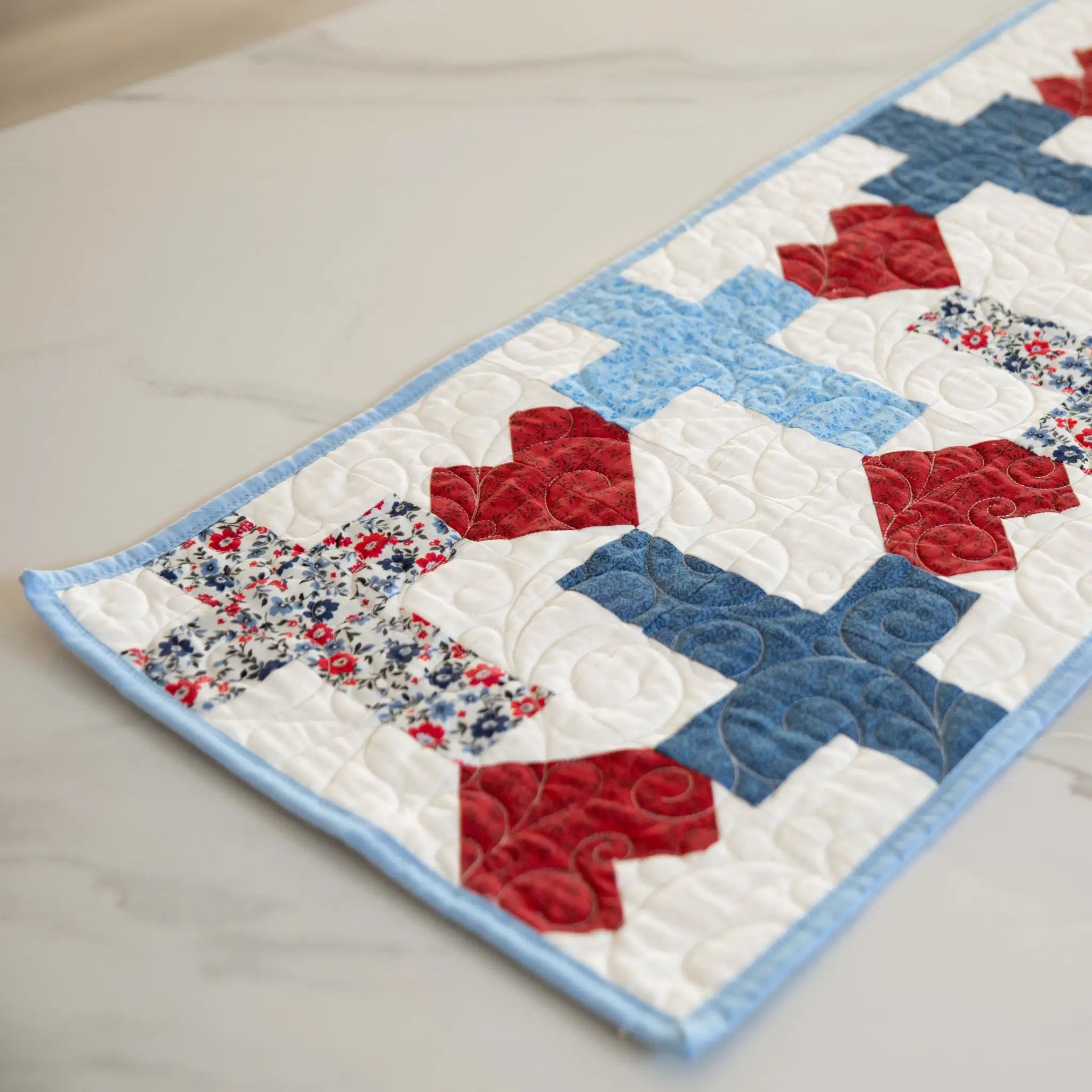 Quilt Kit God Bless America Crosses and Hearts Table Runner; patriotic red, white and blue with floral border.
