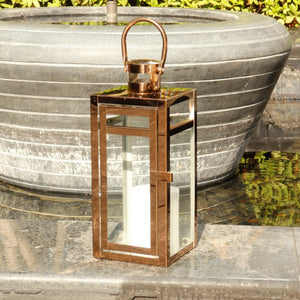 12-inch rose gold metal decorative candle lantern with glass panels and arched handle
