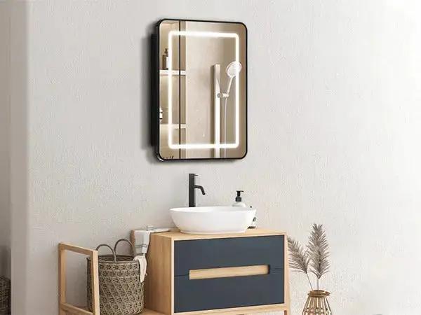 Hausvita framed recessed LED medicine cabinet with black frame and illuminated mirror above bathroom vanity.
