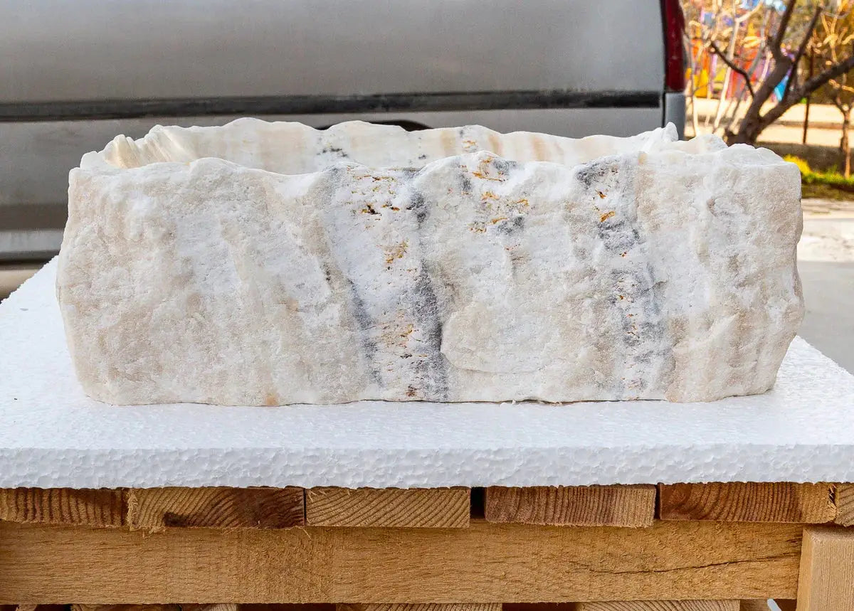 Honey Onyx rectangular bathroom vanity stone sink with polished interior and hand-chiseled exterior.