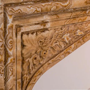 Fireplace surround hand-carved Honey Onyx by Villohome, translucent natural stone, French Villa style.