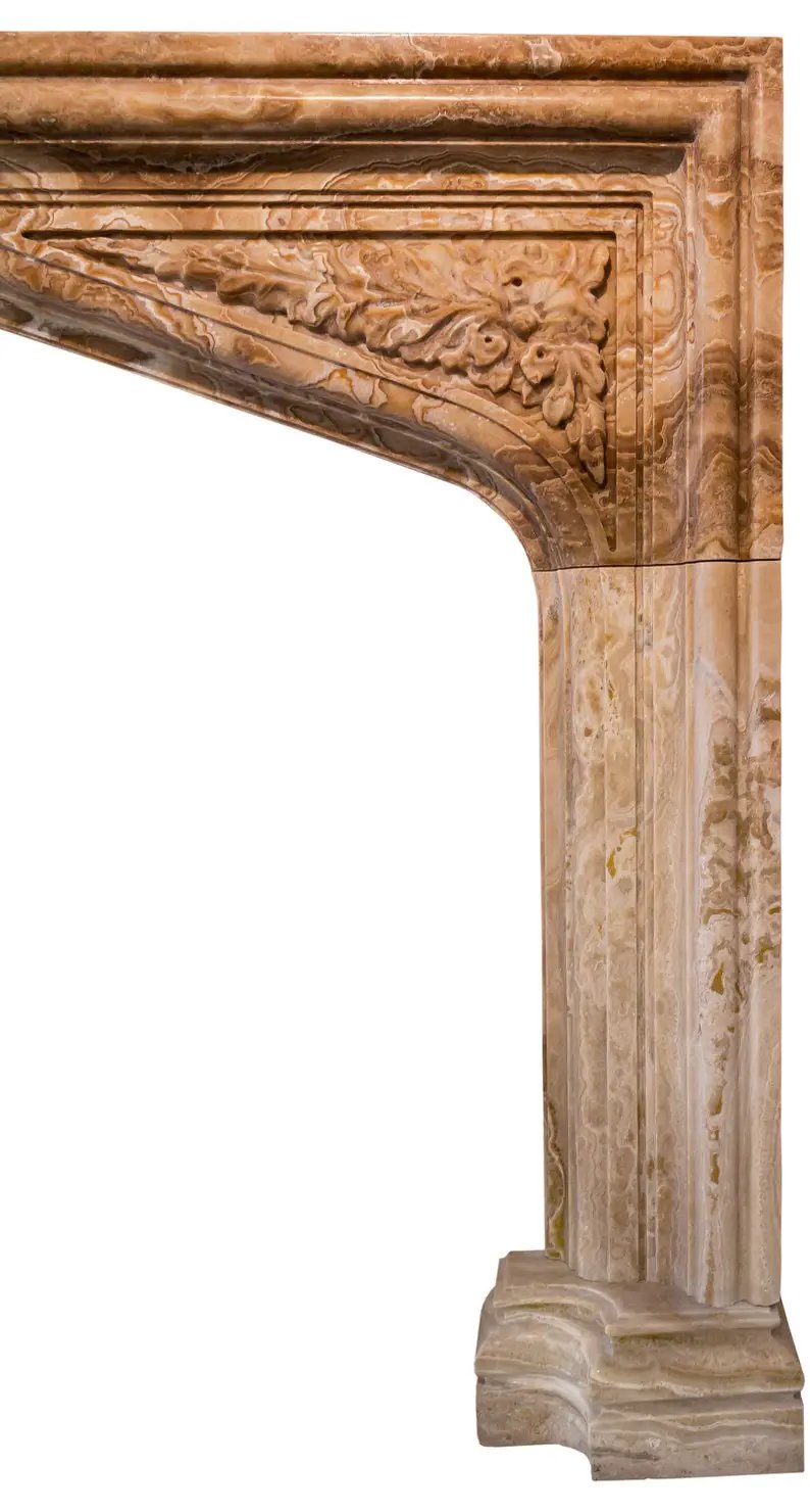 Fireplace surround Honey Onyx translucent natural stone, French Villa style, hand-carved detailing.