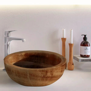 Bathroom vessel sink Honey Onyx translucent natural stone by Villohome on white vanity with faucet.