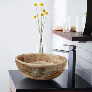 Bathroom vessel sink Honey Onyx by Villohome; polished translucent natural stone on a vanity