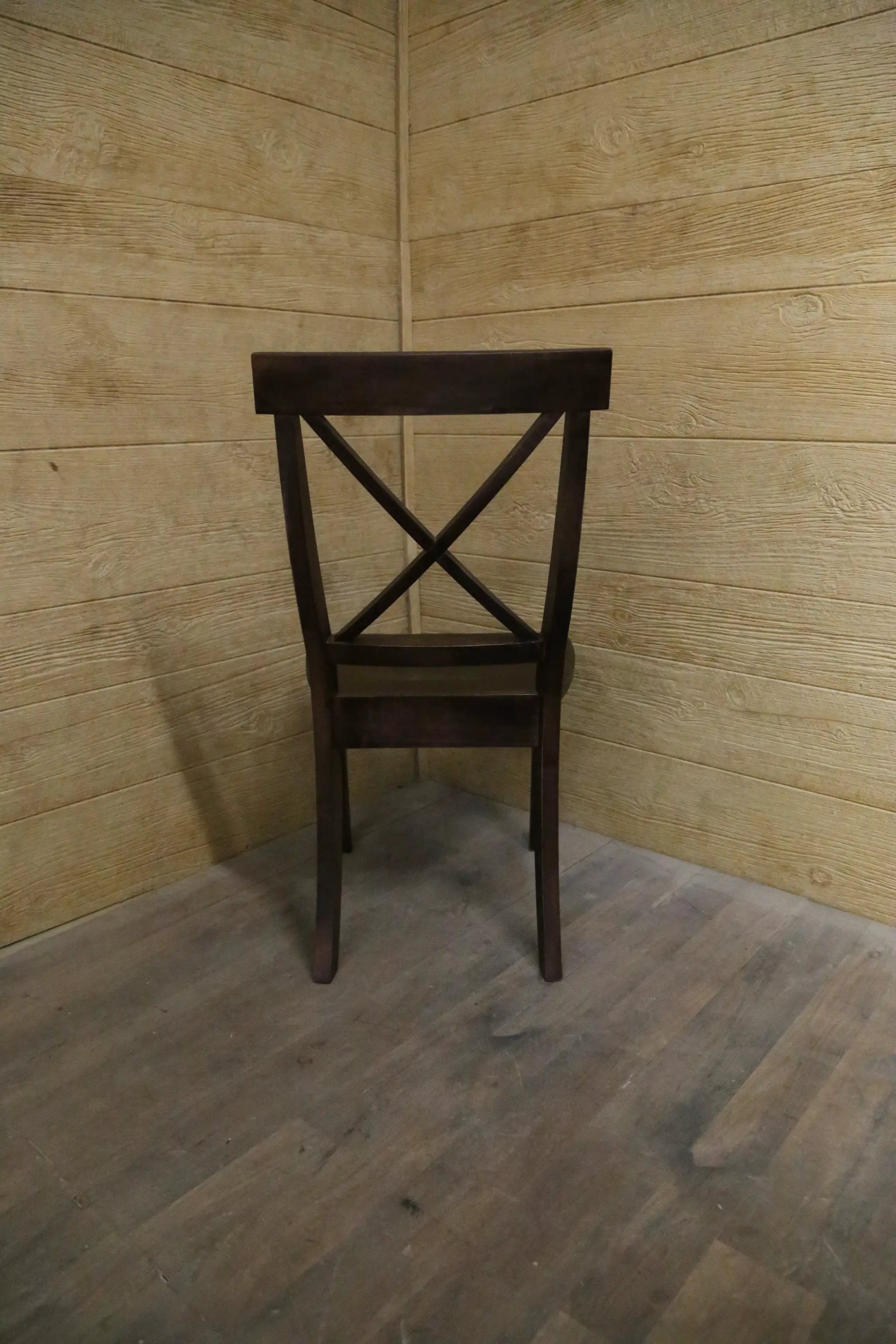 Single X Chair by Wooden Whale Workshop; dark wood chair with cross-back design
