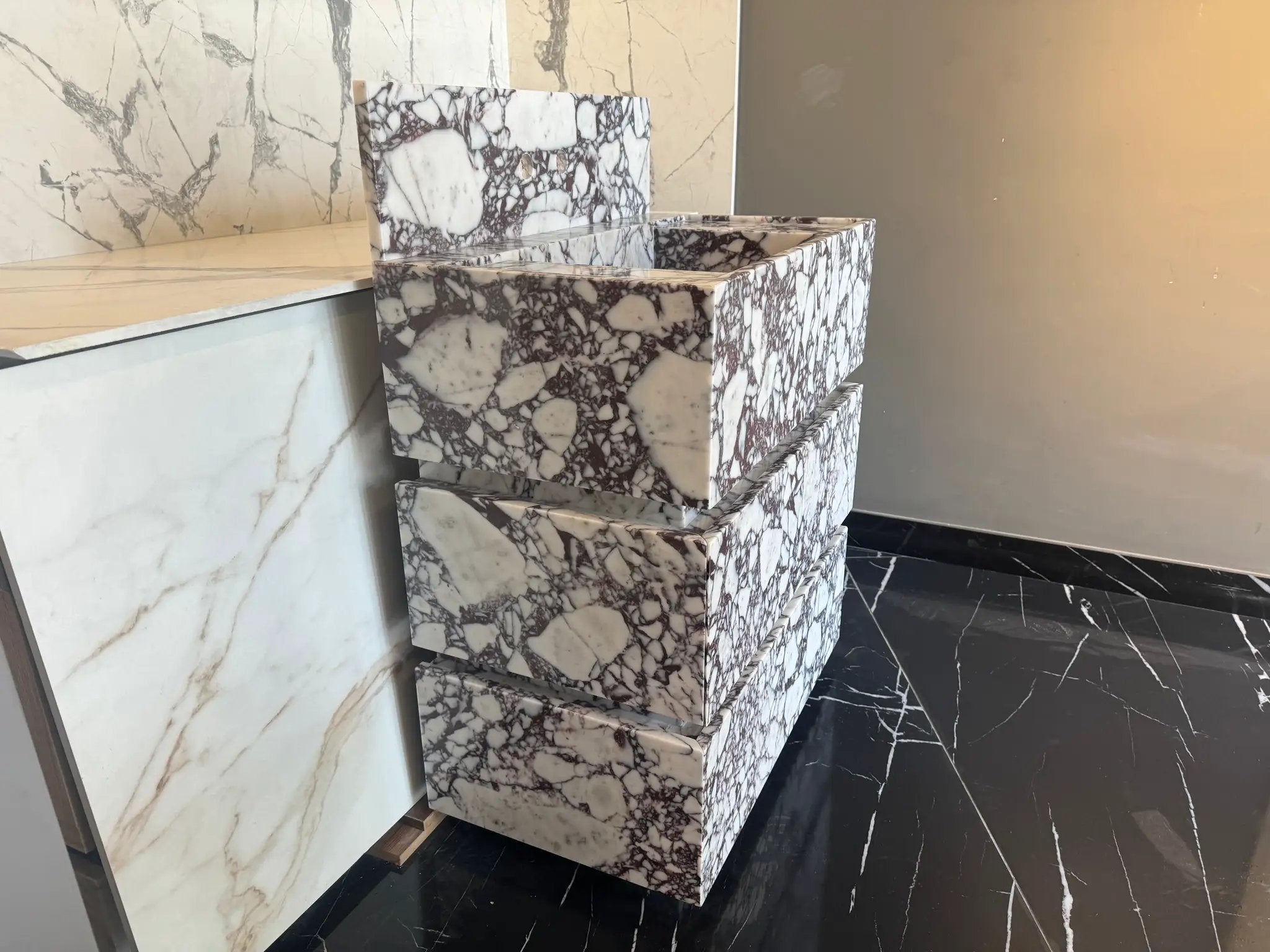 Calacatta Viola marble vanity freestanding blocks stacked for display, white with purple veining
