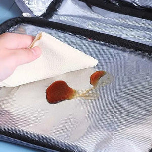 LITEGUEST USB heated lunch bag, portable waterproof lunch bag with a silver interior being wiped clean