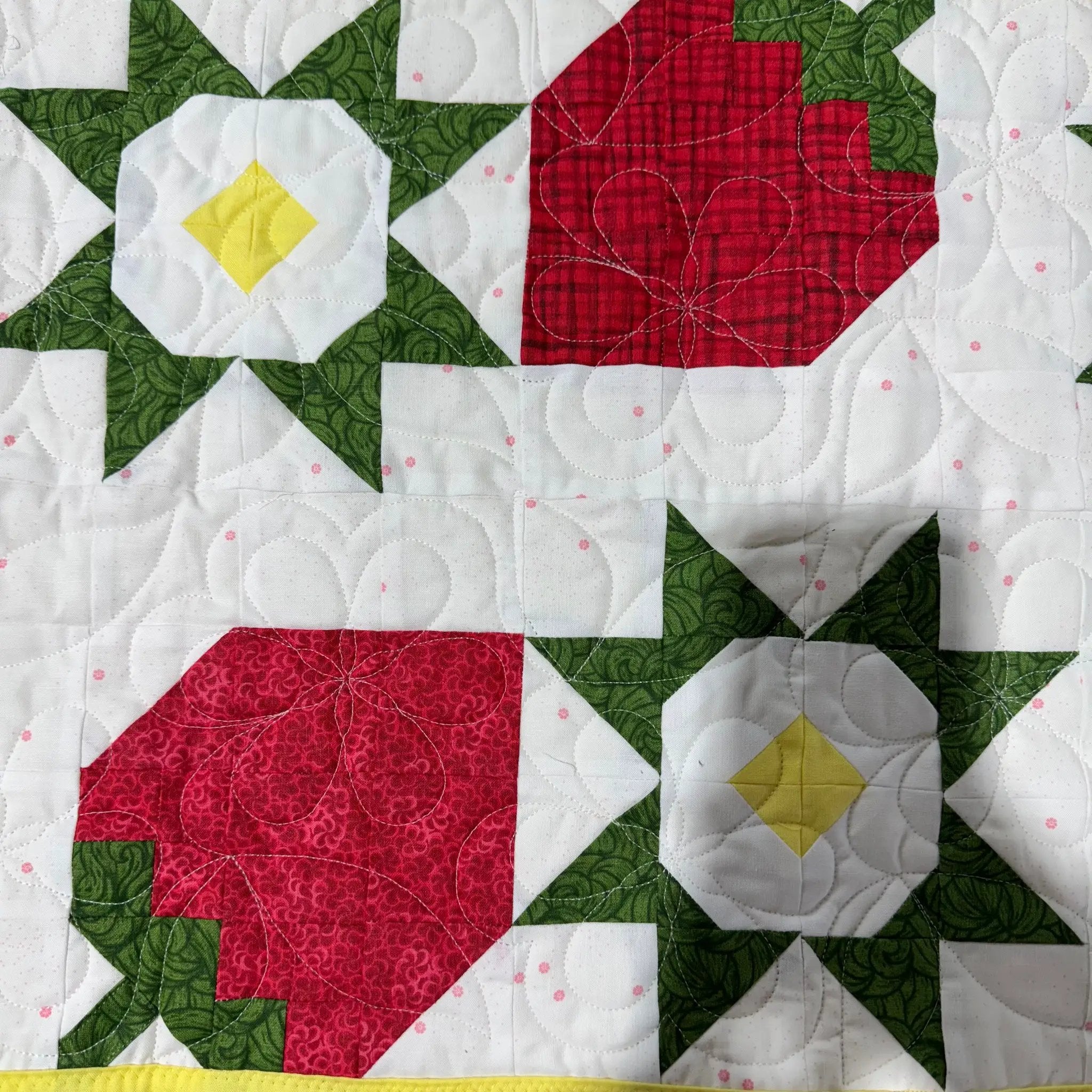 Strawberry Table Runner Kit by Block Party Quilt Co; red strawberry blocks with green leaves on white background