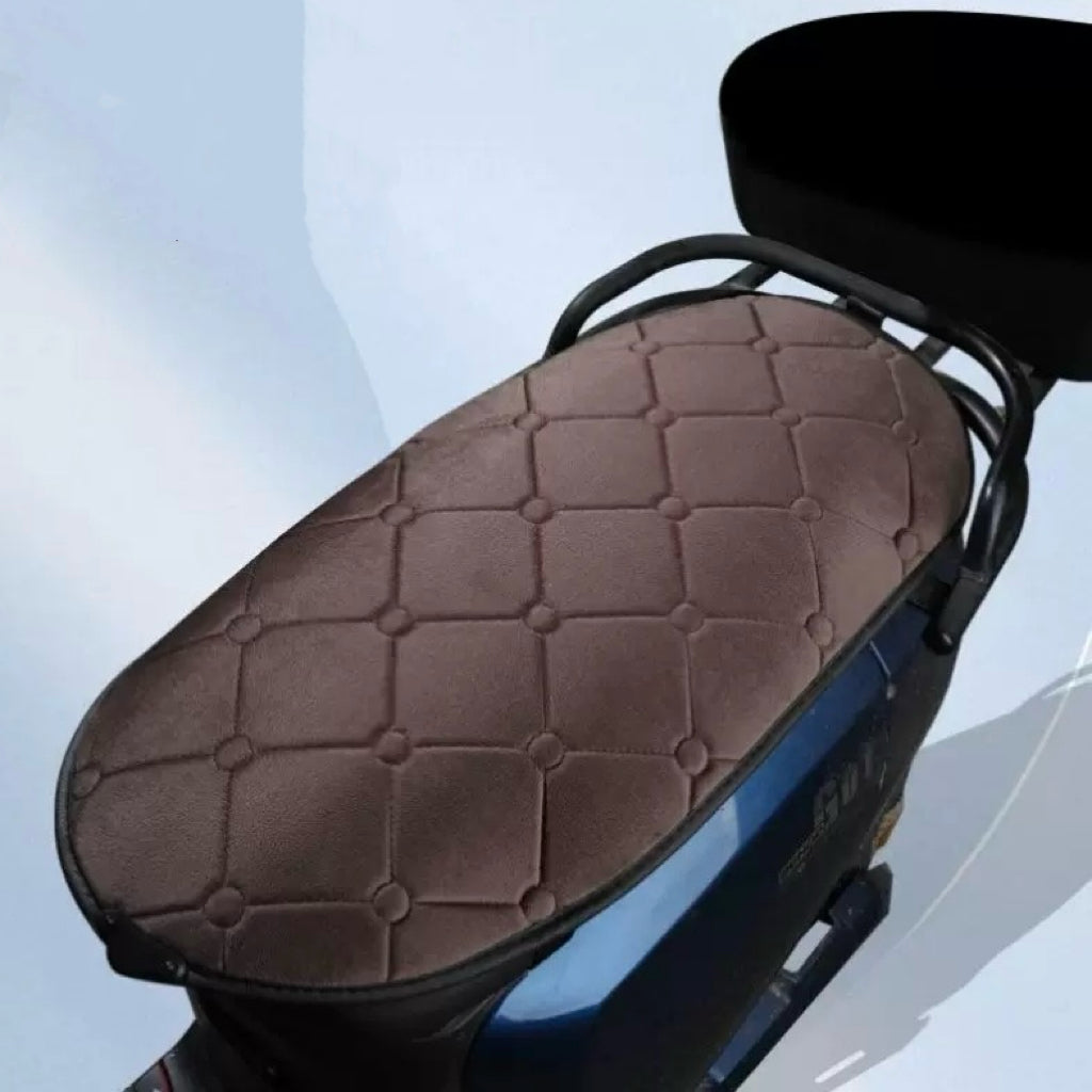 LITEGUEST heated motorcycle seat cover, brown quilted padding on a blue motorcycle seat.