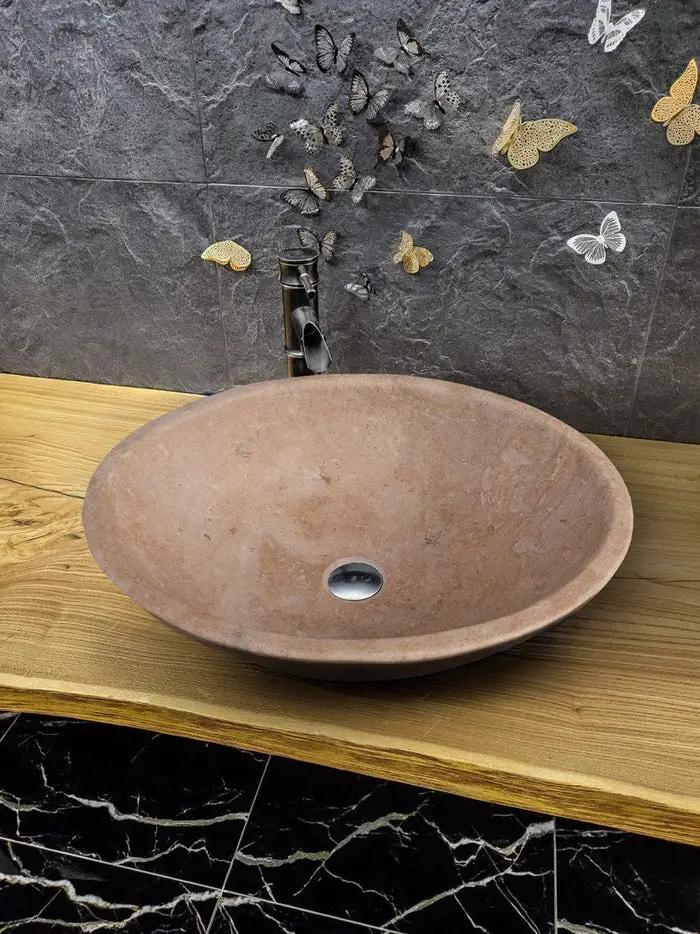 Stone sink Karina Walnut Travertine oval bathroom vessel sink by Villohome on a wood vanity