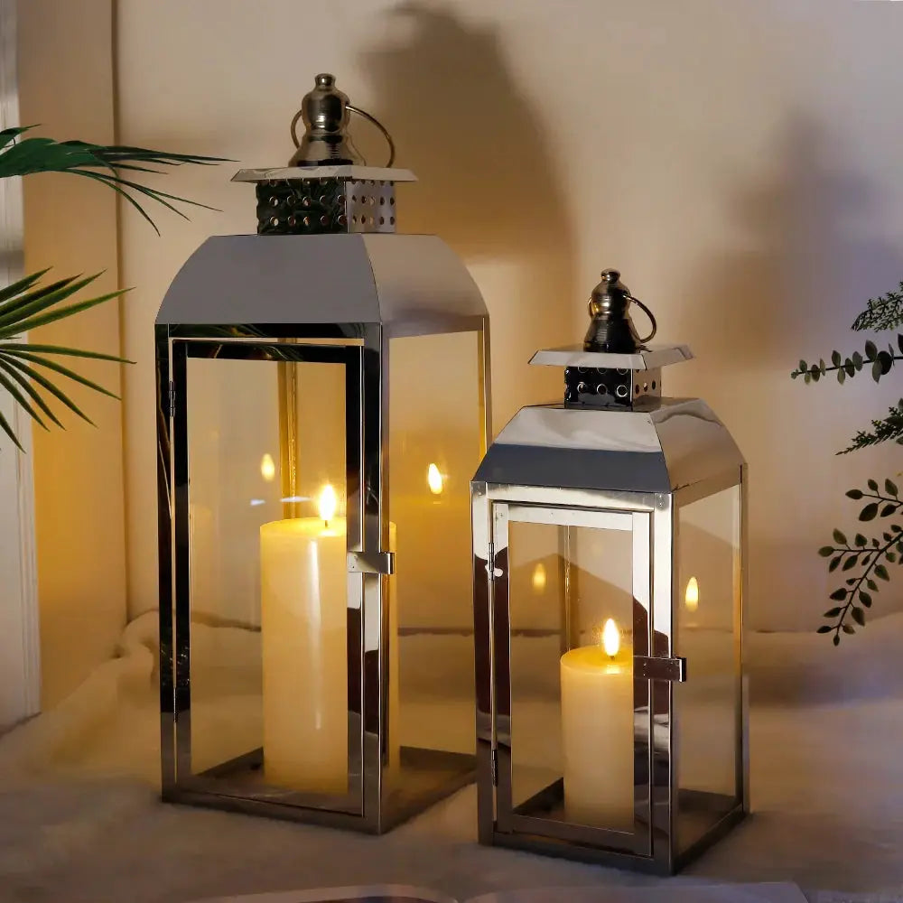 Decorative candle lanterns set of 2 in stainless steel by JHY DESIGN; tall 20.5in and 15in with glass panels