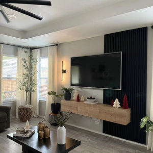 HAUSVITA luxury black acoustic solid wood wall panels, vertical slat design (2 panels per box) in living room behind TV.